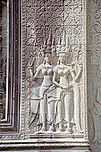 Angkor Wat temple, the fourth enclosure, the bas reliefs of the west gopura, superbly preserved devatas, either individually or in groups of two or three, amongst the finest in the monument. 